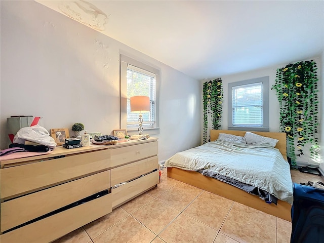 bedroom featuring light tile patterned floors