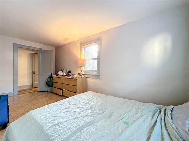 bedroom with light tile patterned flooring