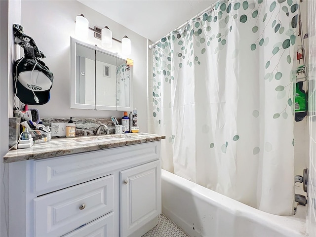 bathroom featuring shower / tub combo and vanity