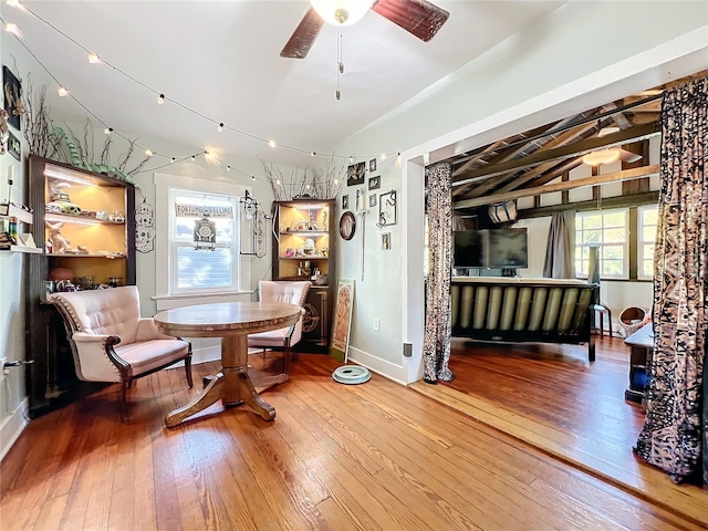 dining space featuring ceiling fan and wood-type flooring