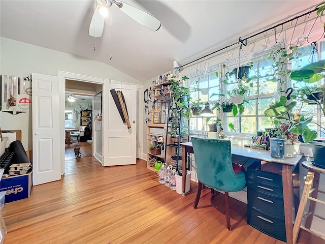 office featuring hardwood / wood-style floors, ceiling fan, and lofted ceiling