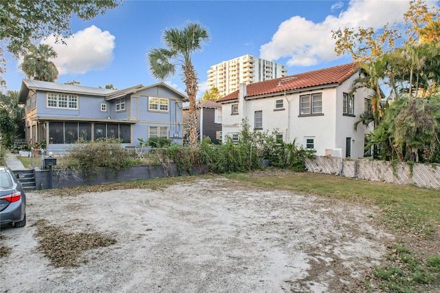 back of property featuring a sunroom