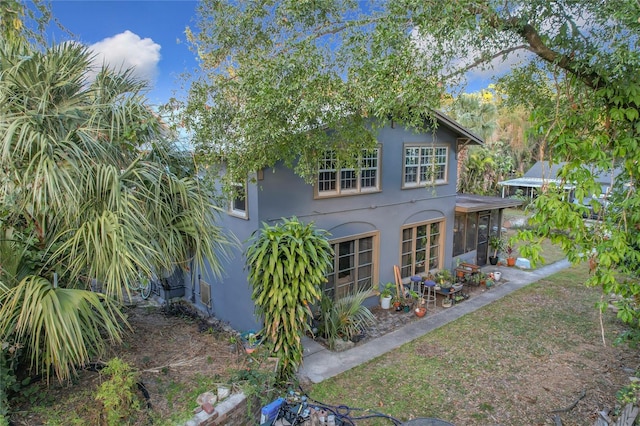 view of front facade featuring a sunroom