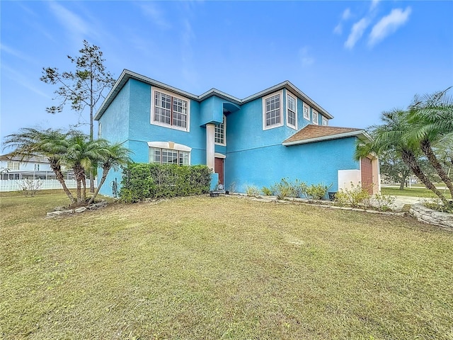 view of front of property with a front lawn