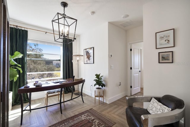 office featuring a chandelier and parquet floors