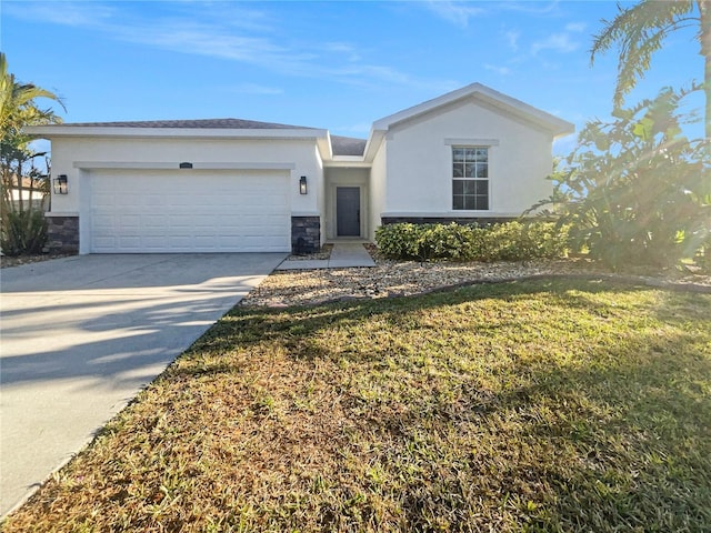 view of front facade with a front yard and a garage