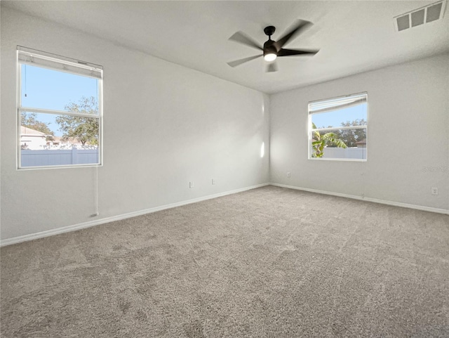 unfurnished room with carpet and ceiling fan