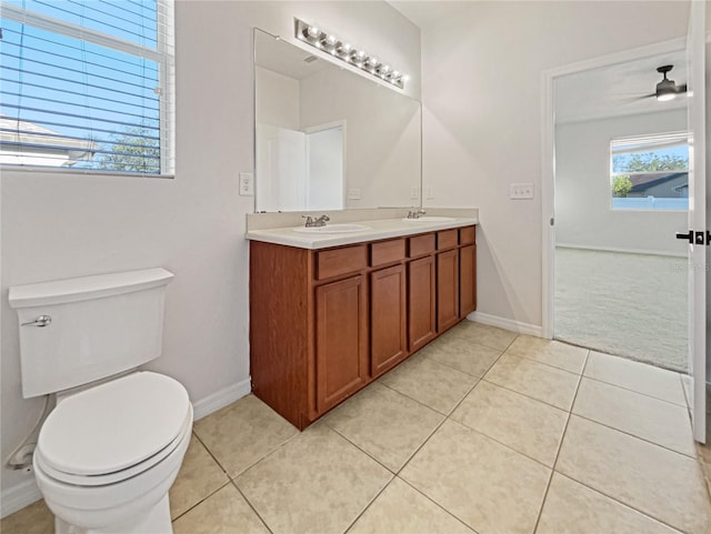 bathroom featuring tile patterned floors, vanity, a wealth of natural light, and ceiling fan