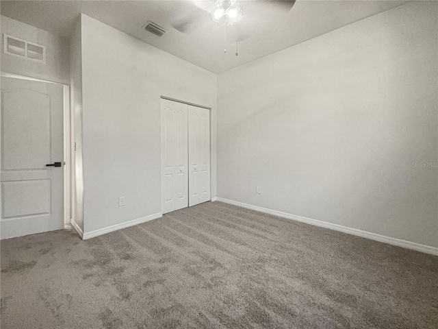 unfurnished bedroom featuring ceiling fan, carpet floors, and a closet