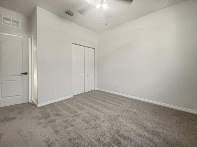 3105 46th St E, Palmetto, FL 34221 - unfurnished bedroom with carpet floors, a closet, and a ceiling fan
