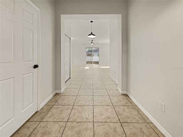 corridor featuring light tile patterned floors