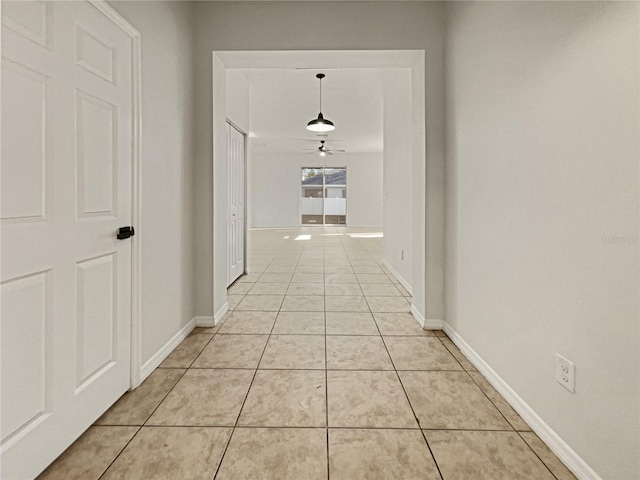 3105 46th St E, Palmetto, FL 34221 - hall featuring light tile patterned flooring and baseboards