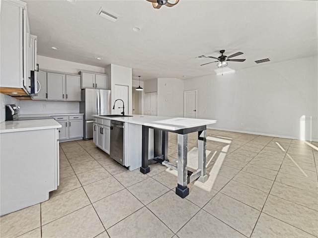 3105 46th St E, Palmetto, FL 34221 - kitchen featuring appliances with stainless steel finishes, light tile patterned flooring, light countertops, and recessed lighting