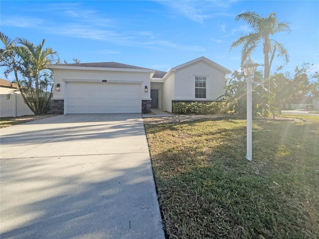 ranch-style home with a garage and a front lawn