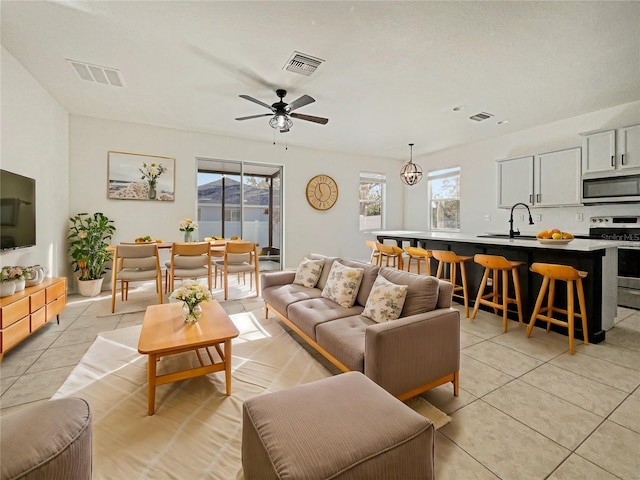 3105 46th St E, Palmetto, FL 34221 - living area featuring light tile patterned flooring and ceiling fan
