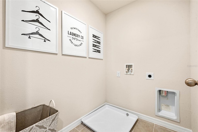 clothes washing area featuring washer hookup, hookup for an electric dryer, and light tile patterned flooring