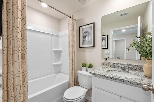 full bathroom with shower / bath combo, vanity, and toilet