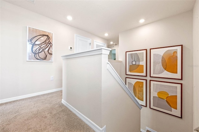 corridor with light colored carpet