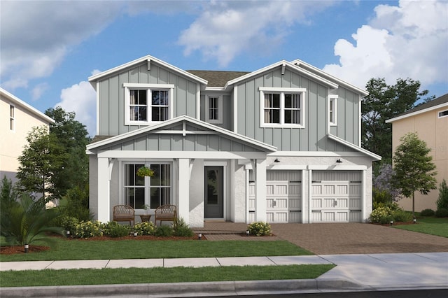 view of front of house featuring a garage and a front yard