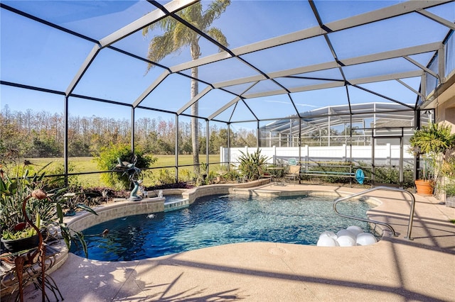 view of pool with a lanai and a patio