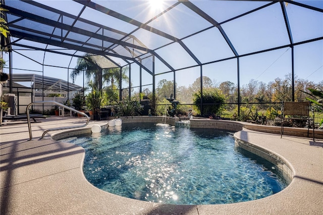 view of swimming pool with glass enclosure and a patio area