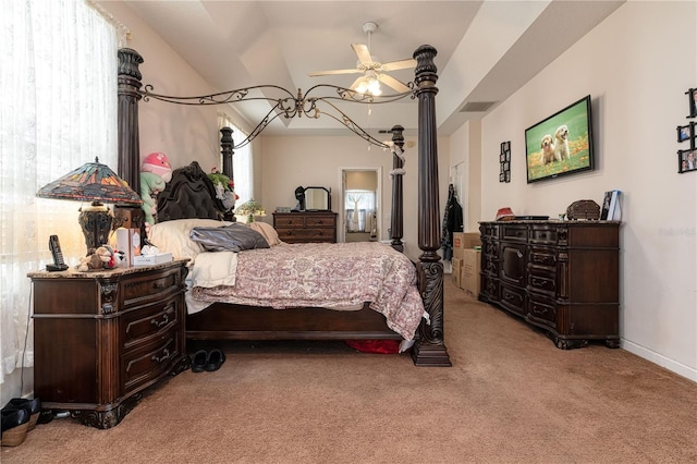 carpeted bedroom featuring ceiling fan and lofted ceiling