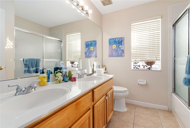 full bathroom with tile patterned flooring, vanity, toilet, and enclosed tub / shower combo