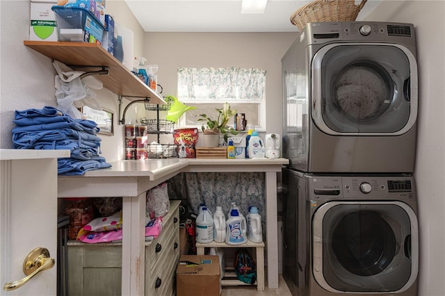 laundry room with stacked washer / drying machine