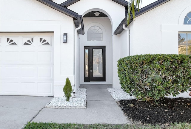 entrance to property featuring a garage