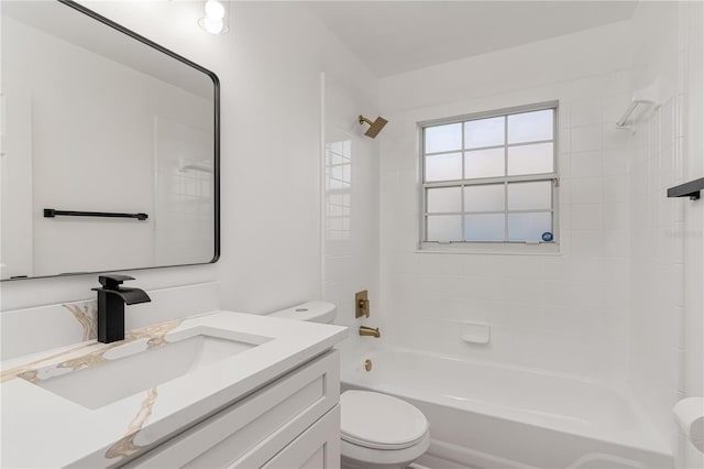 full bathroom featuring vanity, toilet, and tiled shower / bath