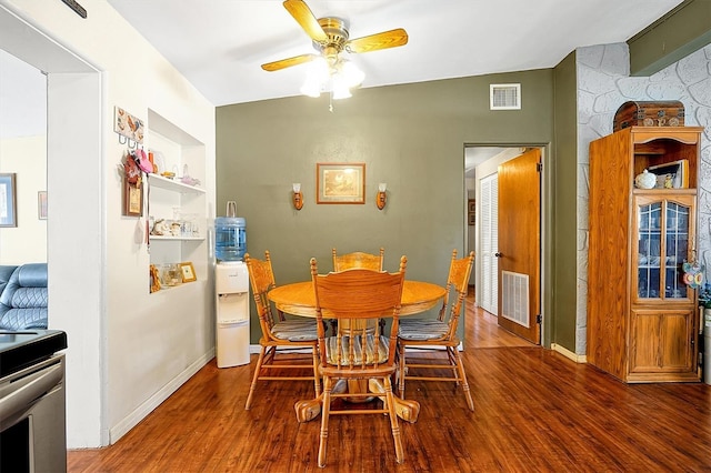 dining space featuring wood-type flooring, ceiling fan, and lofted ceiling