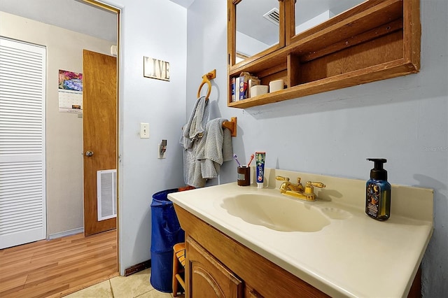 bathroom featuring tile patterned floors and vanity