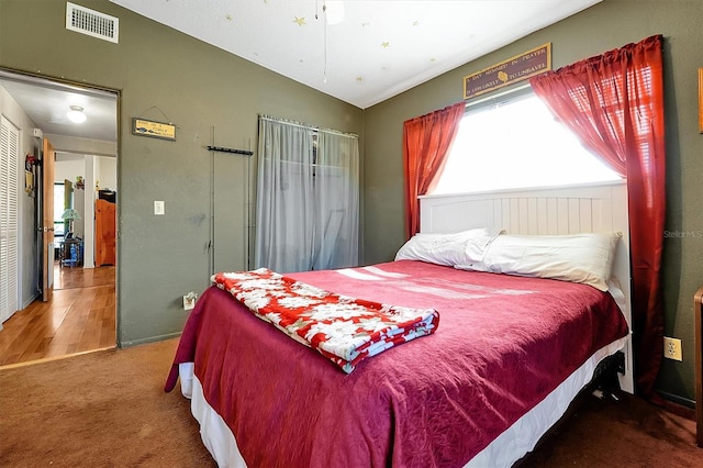 bedroom with carpet floors, ceiling fan, and lofted ceiling