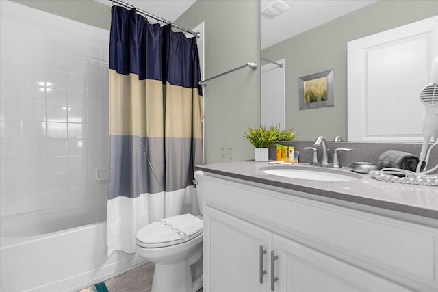 full bathroom with tile patterned floors, vanity, shower / bath combo, and toilet