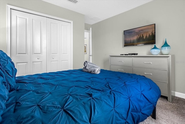 carpeted bedroom featuring a closet