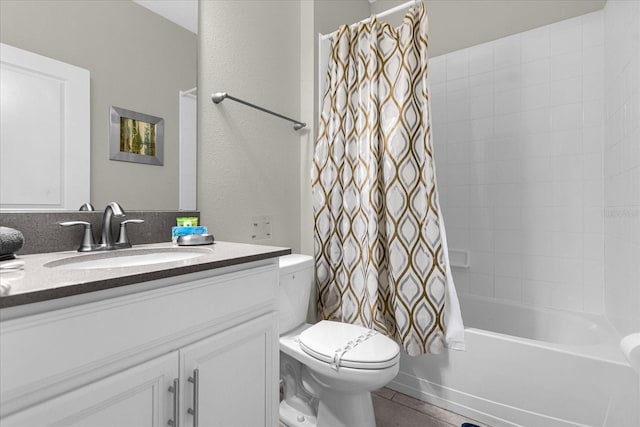 full bathroom with vanity, tile patterned flooring, shower / bathtub combination with curtain, and toilet