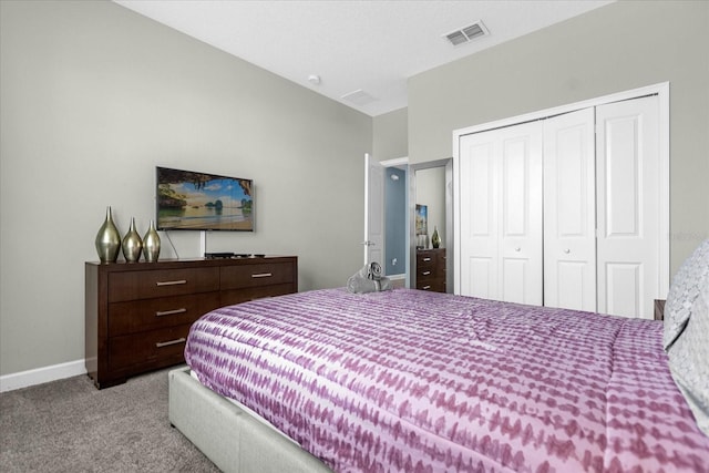 carpeted bedroom featuring a closet