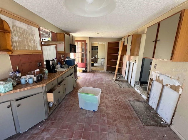 kitchen featuring a textured ceiling