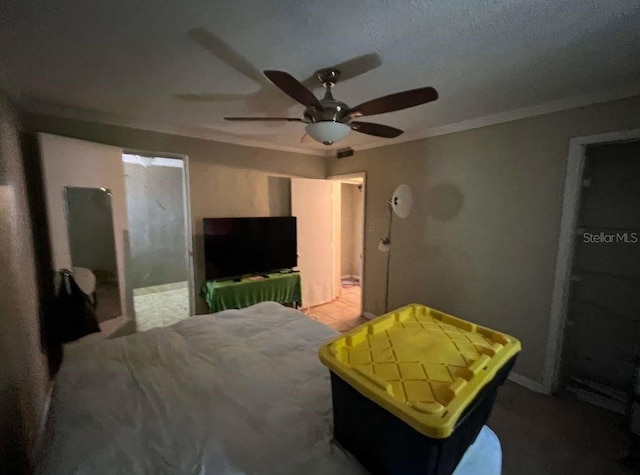 bedroom featuring ensuite bathroom and ceiling fan