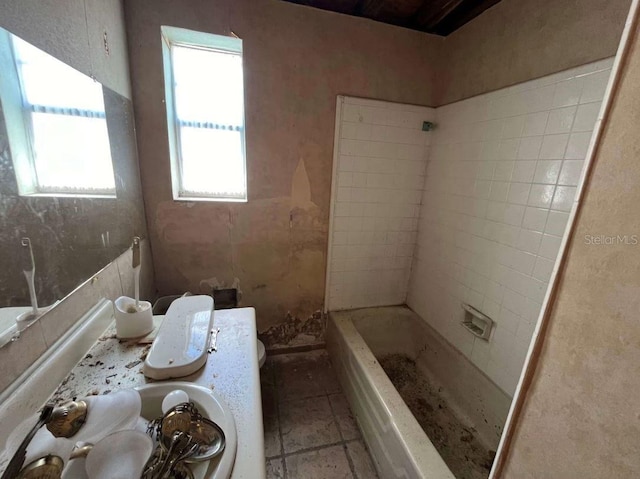 bathroom with a tub to relax in