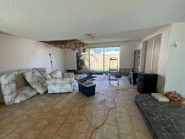 living room featuring a textured ceiling