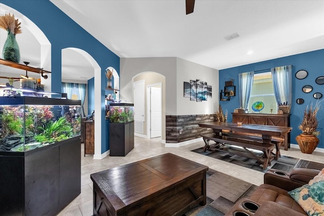 living room with light tile patterned flooring and a healthy amount of sunlight