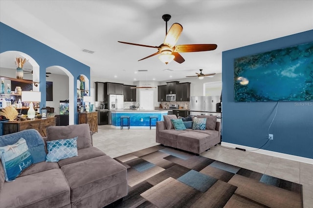 living room featuring ceiling fan