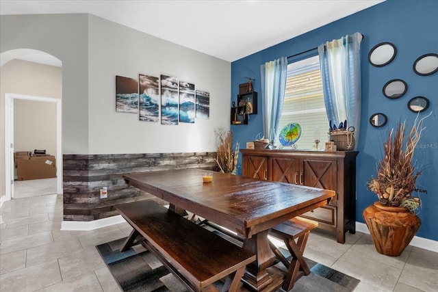 dining area with light tile patterned floors