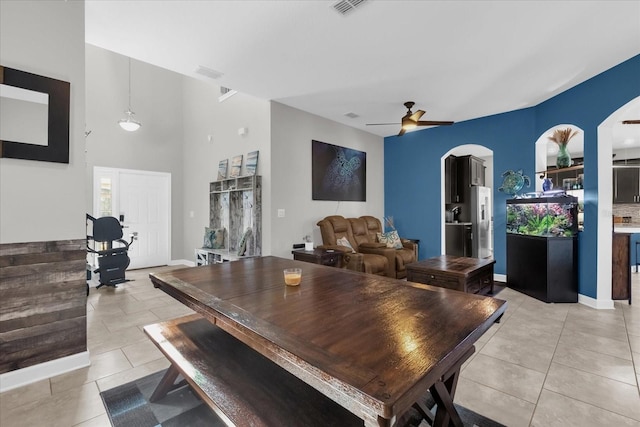 tiled dining area featuring ceiling fan