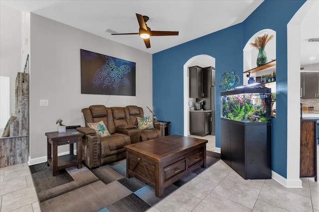 tiled living room featuring ceiling fan