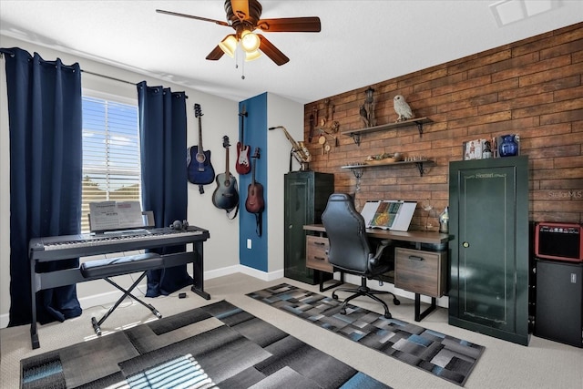 carpeted office space featuring ceiling fan