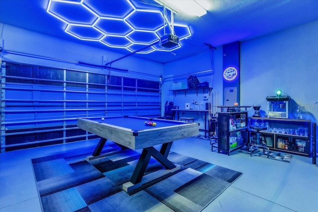 playroom featuring a textured ceiling, a towering ceiling, and pool table