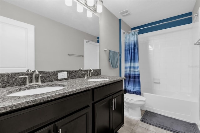 full bathroom with toilet, vanity, tile patterned floors, and shower / bath combo with shower curtain