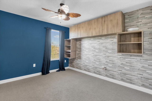 carpeted empty room with ceiling fan